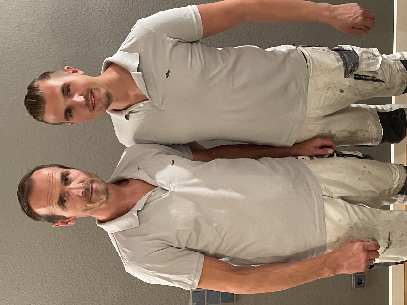 Ralf Lorbach und sein Sohn André Lorbach in Arbeitskleidung